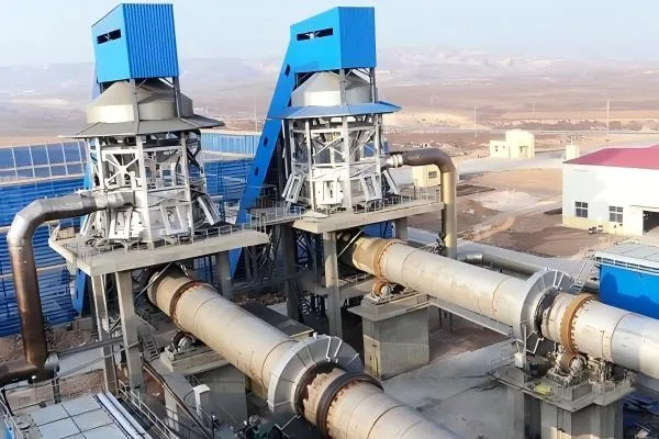 Twin rotary lime kiln shells with preheating and gas handling structures