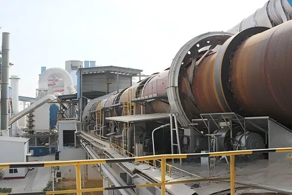 Industrial rotary kiln shell riding ring and support system in a thermal processing line